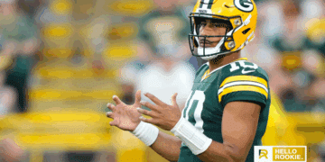 Jordan Love of the Green Bay Packers drops back to pass against the Washington Commanders on Thursday Night Football.