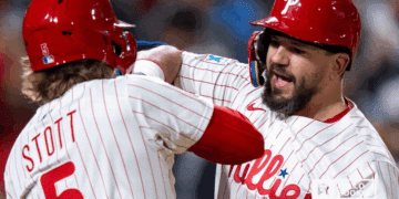 Kyle Schwarber of the Philadelphia Phillies swings for power against the New York Mets at Citizens Bank Park.