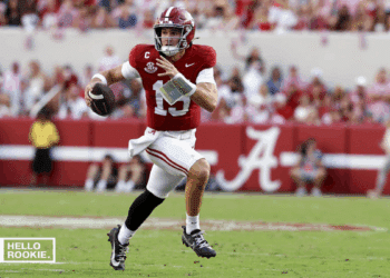 Ty Simpson of the Alabama Crimson Tide throws under the lights at Bryant-Denny Stadium against Tennessee.