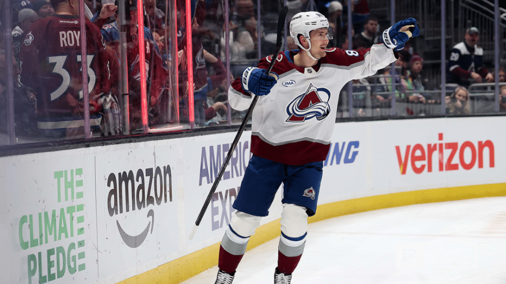Martin Necas of the Colorado Avalanche handles the puck against the Calgary Flames at Ball Arena