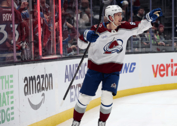 Martin Necas of the Colorado Avalanche handles the puck against the Calgary Flames at Ball Arena