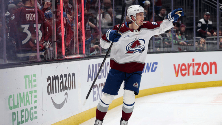 Martin Necas of the Colorado Avalanche handles the puck against the Calgary Flames at Ball Arena
