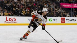 Jackson LaCombe skating with the puck for the Anaheim Ducks
