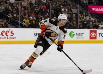 Jackson LaCombe skating with the puck for the Anaheim Ducks