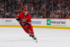 Sebastian Aho skating with puck for the Carolina Hurricanes