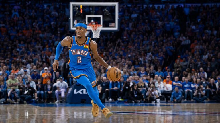 Shai Gilgeous-Alexander driving to the basket for the Oklahoma City Thunder