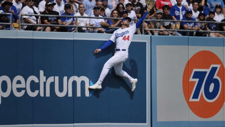 Andy Pages of the Los Angeles Dodgers making a leaping catch at Dodger Stadium