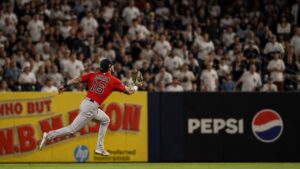 Jarren Duran sprinting in the outfield for the Boston Red Sox at Yankee Stadium