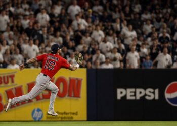 Jarren Duran sprinting in the outfield for the Boston Red Sox at Yankee Stadium
