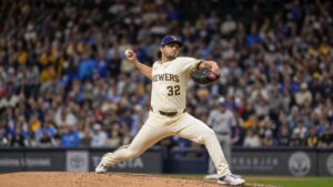 Milwaukee Brewers pitcher in wind-up delivery on the mound