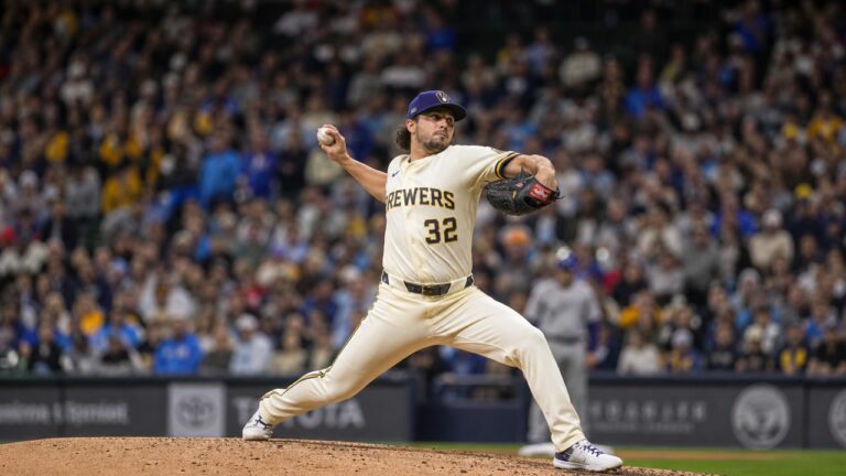 Milwaukee Brewers pitcher in wind-up delivery on the mound
