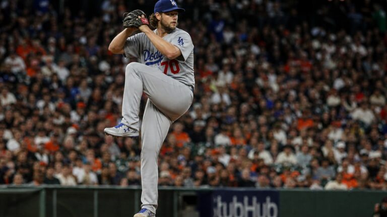 MLB pitcher in full wind-up delivery on the mound, game-ready pitching action shot