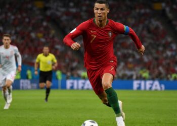 Soccer player in red national team jersey at the 2026 FIFA World Cup