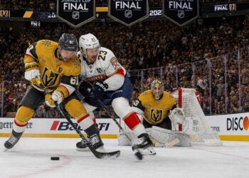 Hockey players battling for the puck during the Stanley Cup Final