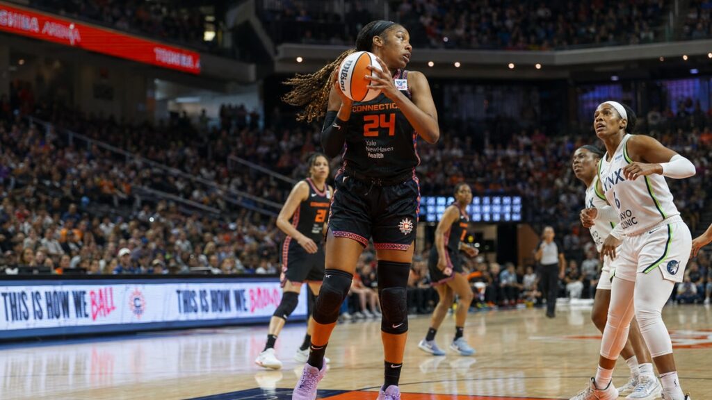 Aneesah Morrow grabbing a rebound for the Connecticut Sun against the Indiana Fever