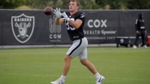 Brock Bowers catching a pass for the Las Vegas Raiders during practice