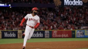 Jo Adell rounding third base for the Los Angeles Angels at Angel Stadium