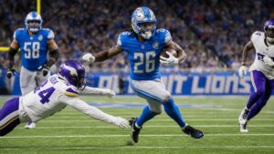 Jahmyr Gibbs running with the football for the Detroit Lions