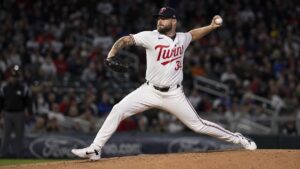A.J. Minter pitching for the Minnesota Twins after being traded by the Mets