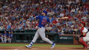 Michael Busch of the Chicago Cubs following through on a swing