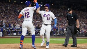 MLB players celebrating at home plate