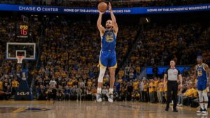 Stephen Curry in mid jump shot for the Golden State Warriors