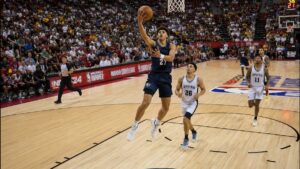 NBA rookie driving to the basket during summer league action