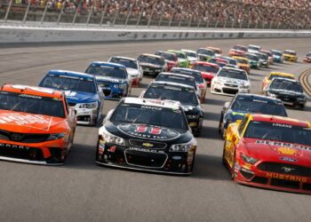 NASCAR Cup Series cars drafting in a tight pack during a superspeedway-style race