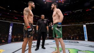 Two fighters facing off in the octagon before UFC 329 McGregor vs Holloway 2
