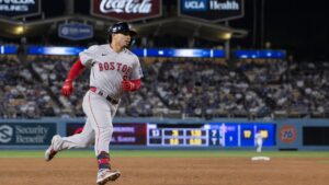 Andruw Monasterio of the Boston Red Sox rounds third base during a road game against the Los Angeles Dodgers