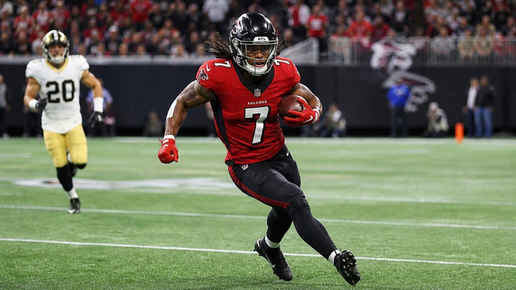 Bijan Robinson running with the ball for the Atlanta Falcons after signing his record contract extension