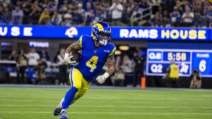 Blake Corum running with the ball for the Los Angeles Rams