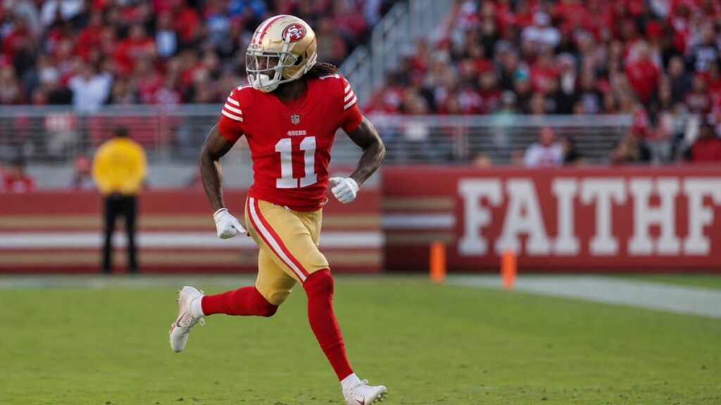 Brandon Aiyuk running a route in a San Francisco 49ers uniform