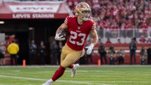Christian McCaffrey running with the ball for the San Francisco 49ers