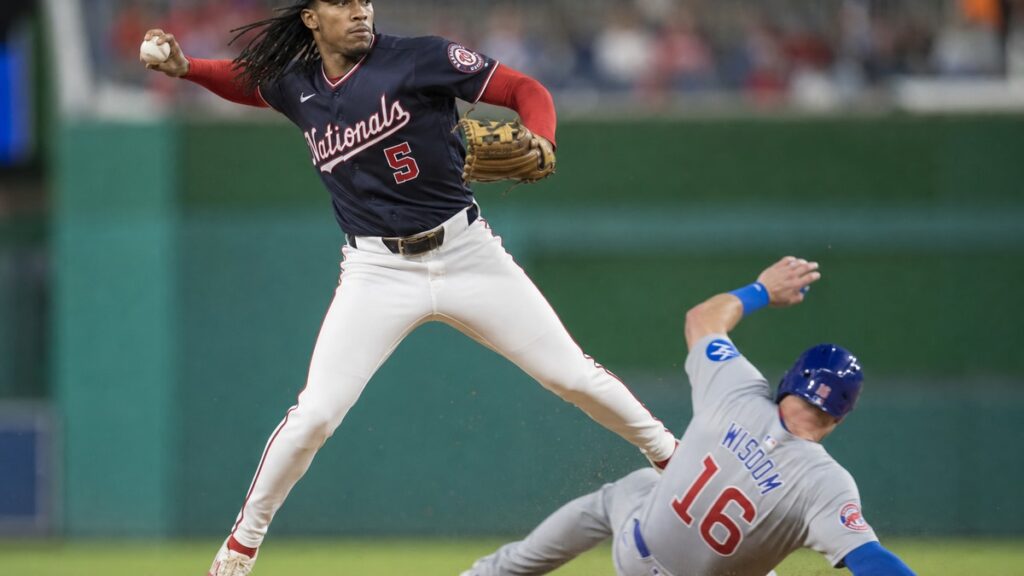 CJ Abrams turning a double play at shortstop for the Washington Nationals