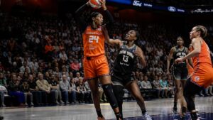 Aneesah Morrow grabbing a rebound for the Connecticut Sun