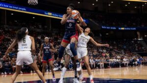 Shakira Austin grabbing a rebound for the Washington Mystics against the Dallas Wings