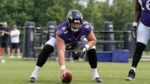 Danny Pinter, Baltimore Ravens center, in a three-point stance during practice