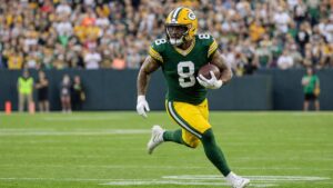 Josh Jacobs running the ball for the Green Bay Packers