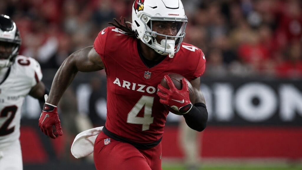 Jeremiyah Love running with the ball for the Arizona Cardinals