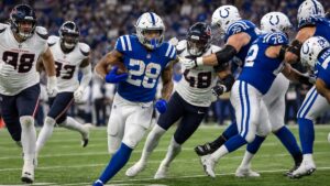 Jonathan Taylor running with the football for the Indianapolis Colts