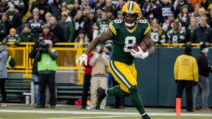 Josh Jacobs running with the ball for the Green Bay Packers
