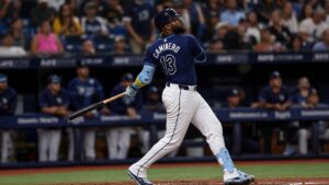 Junior Caminero of the Tampa Bay Rays following through on a home run swing