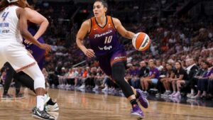 Kelsey Plum driving to the basket in a Phoenix Mercury uniform