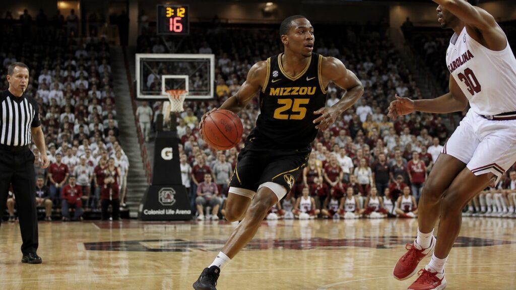 Mark Mitchell driving to the basket for the Missouri Tigers