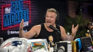 Pat McAfee hosting his sports media show in the broadcast studio