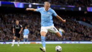 Erling Haaland shooting for Manchester City