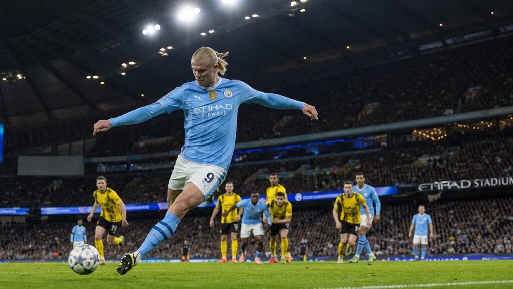 Erling Haaland striking a shot on goal for Manchester City