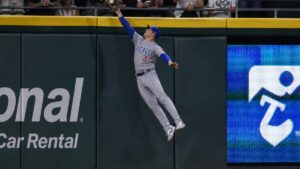 Pete Crow-Armstrong making a leaping catch in center field for the Chicago Cubs