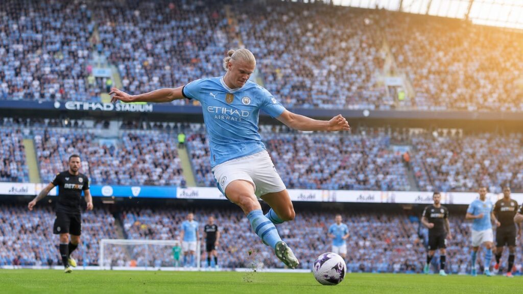Erling Haaland taking a shot on goal for Manchester City at Etihad Stadium